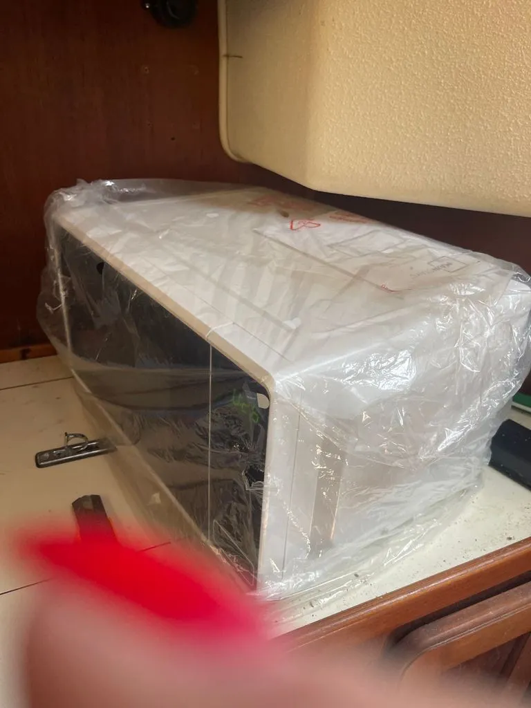 Slide: The Image of A device wrapped in plastic inside a boat cabin. - 7