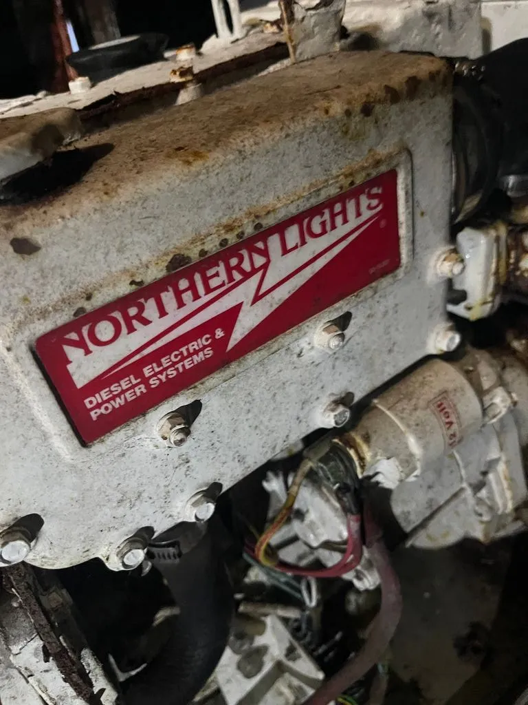 Slide: The Image of Close-up of a Northern Lights diesel engine in a 1985 Catalina Morgan 43 boat. - 14