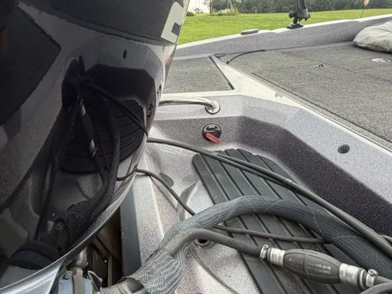 Slide: The Image of Close-up of a Ranger 212LS Reata boat deck with motor and cables. - 23