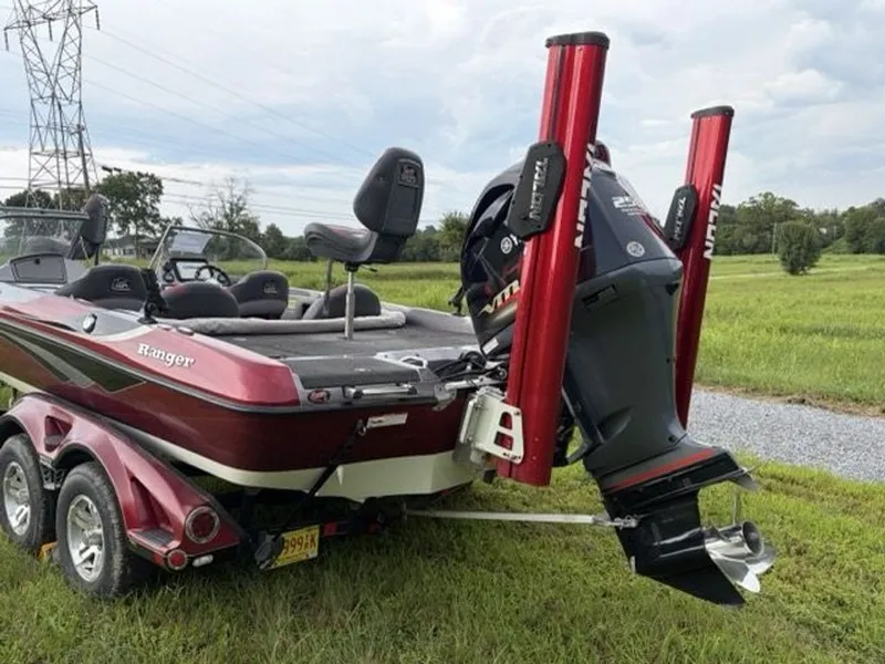 Slide: The Image of A red Ranger 212LS Reata boat with a powerful outboard motor and Power-Pole anchors. - 18