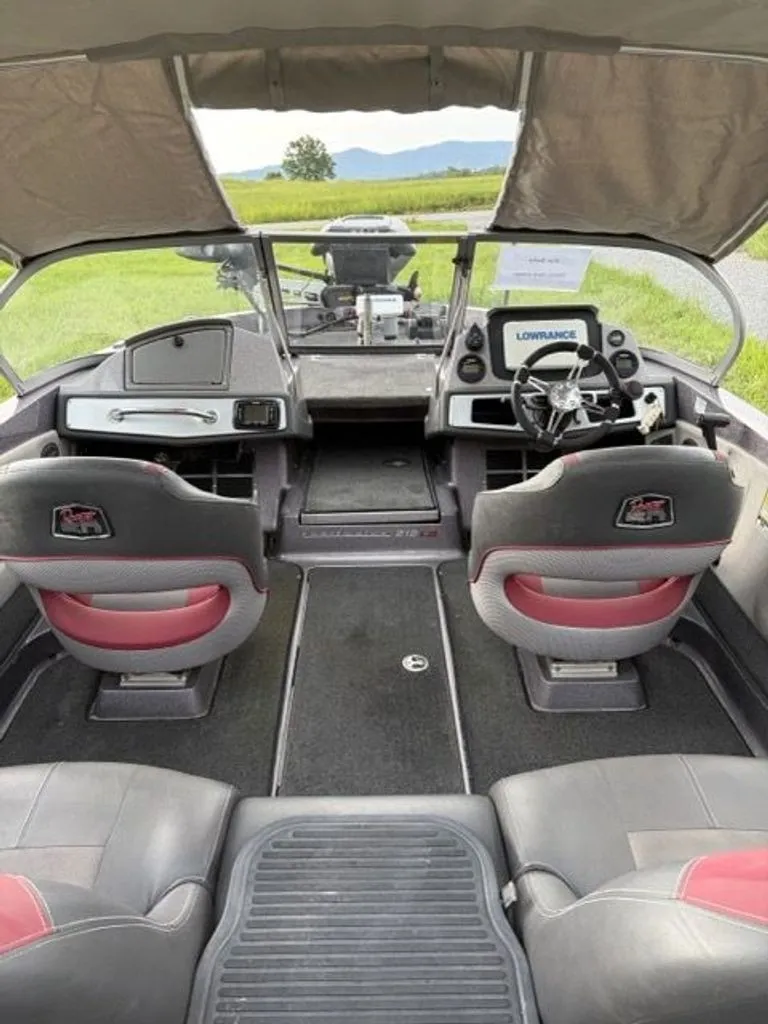 Slide: The Image of The image shows the cockpit of a Ranger 212LS Reata boat with two seats and a Lowrance screen. - 17