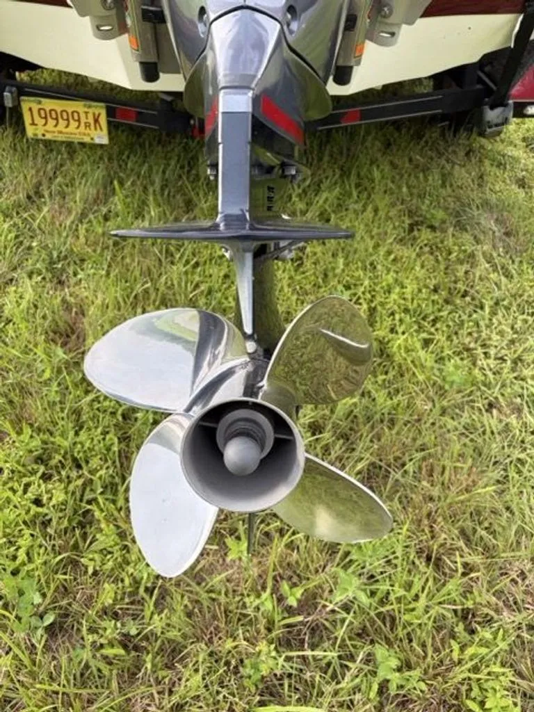Slide: The Image of Close-up of a boat propeller on a trailer in the grass. - 20