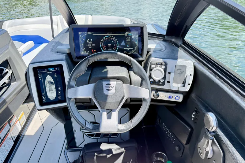 Slide: The Image of 2020 Malibu Wakesetter 24 MXZ dashboard with advanced controls and digital displays. - 19