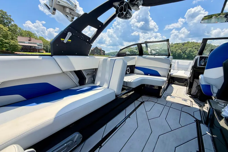Slide: The Image of Interior of 2020 Malibu Wakesetter 24 MXZ boat with luxurious seating and modern design. - 15
