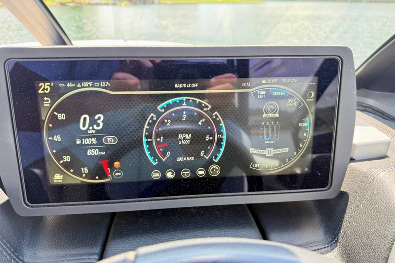 Slide: The Image of Dashboard of 2020 Malibu Wakesetter 24 MXZ showing speed, RPM, and ballast settings. - 21