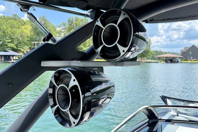 Slide: The Image of Speakers on a 2020 Malibu Wakesetter 24 MXZ boat, with lake view background. - 34
