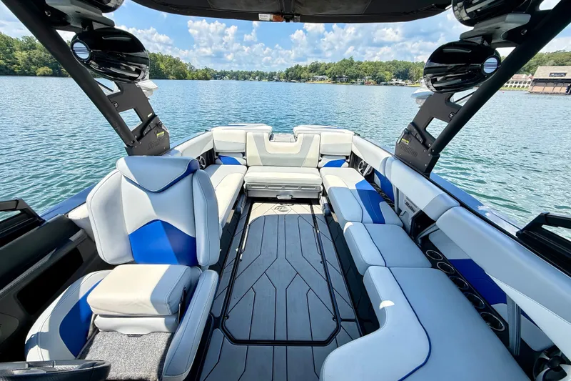 Slide: The Image of 2020 Malibu Wakesetter 24 MXZ boat interior with luxurious seating on a lake. - 29