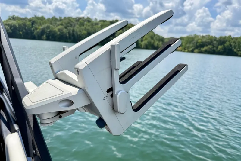 Slide: The Image of Wakeboard rack on 2020 Malibu Wakesetter 24 MXZ, lake view in background. - 33