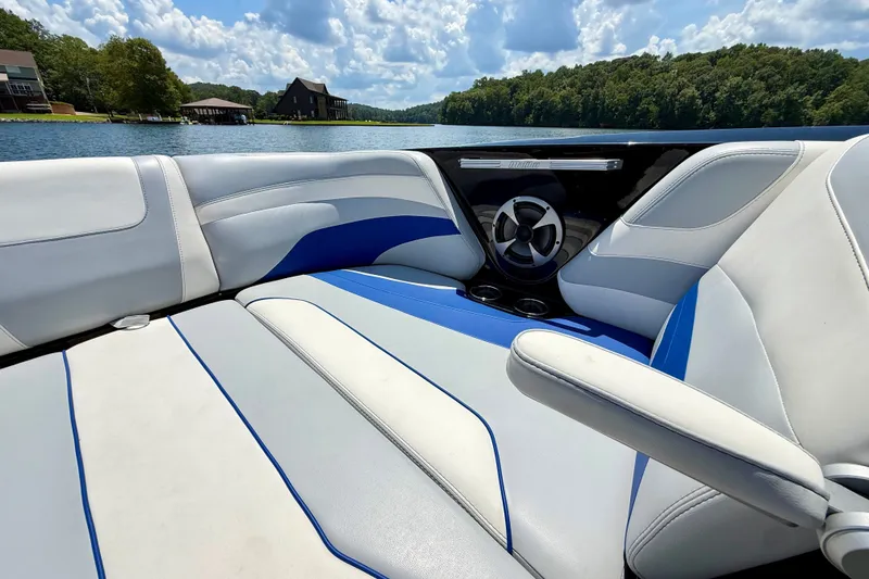 Slide: The Image of Interior of 2020 Malibu Wakesetter 24 MXZ boat with blue and white seating. - 27