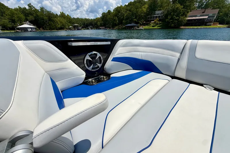 Slide: The Image of Interior of 2020 Malibu Wakesetter 24 MXZ boat with blue and white seating. - 26