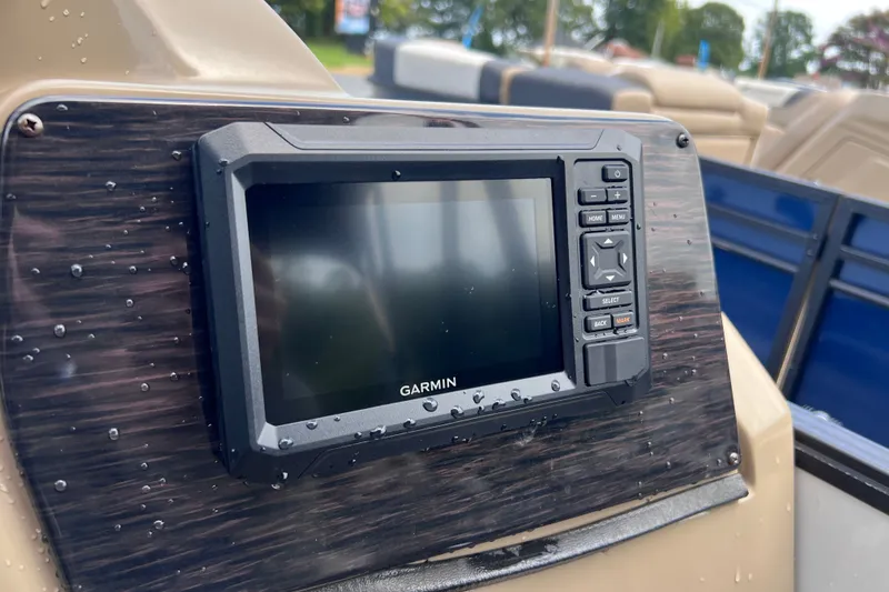 Slide: The Image of Garmin navigation system on 2024 Starcraft SLS 3 boat dashboard, with water droplets. - 12