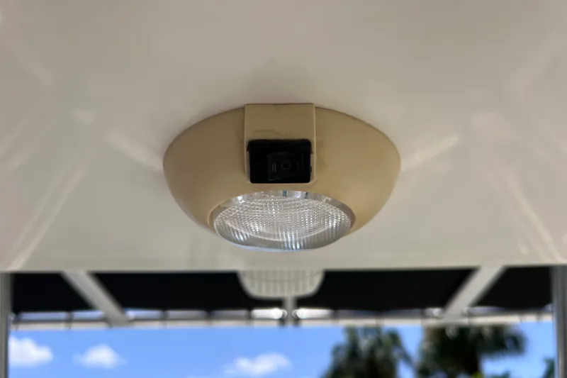 Slide: The Image of Ceiling light fixture on a 2016 Key West 203 FS boat, with a switch. - 32