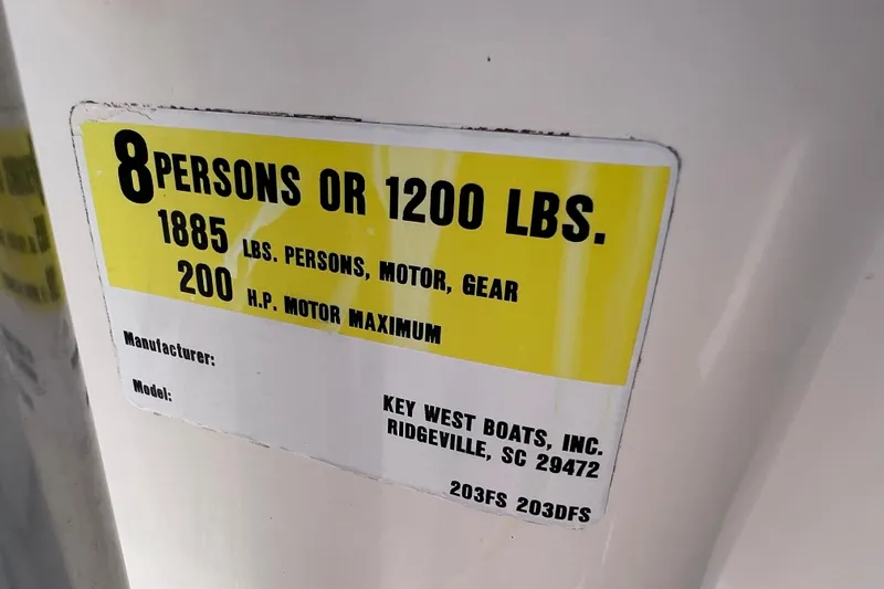 Slide: The Image of Capacity label on 2016 Key West 203 FS boat, 8 persons or 1200 lbs, 200 HP max. - 33