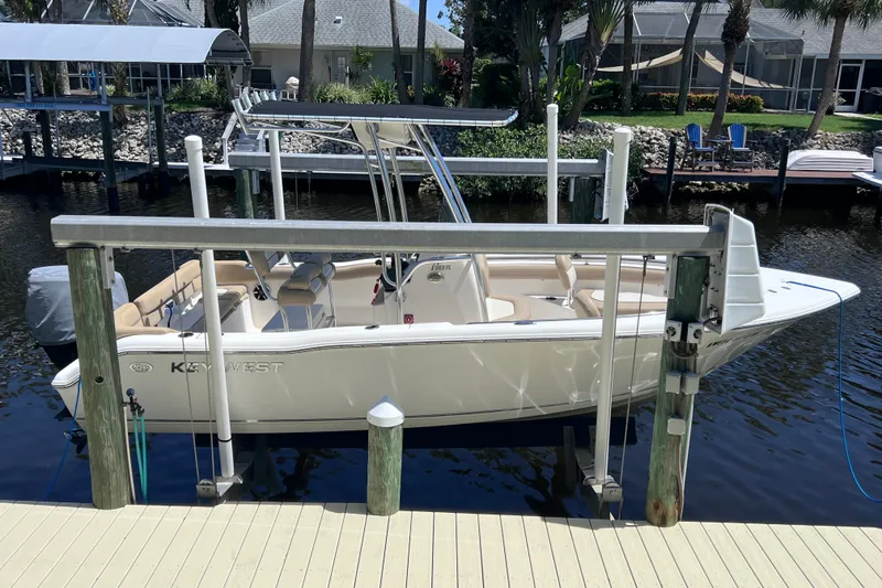 The Image of 2016 Key West 203 FS boat docked in a serene waterfront setting. - 0