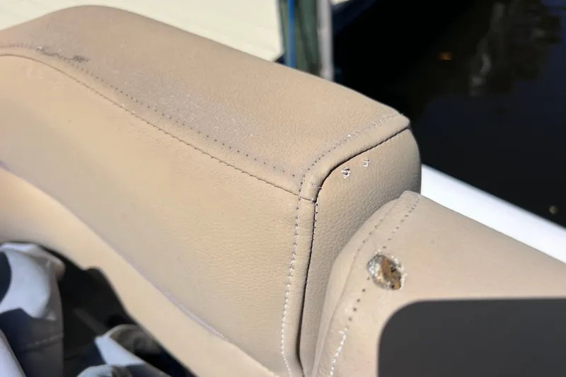 Slide: The Image of Damaged beige upholstery on 2016 Key West 203 FS boat seat. - 38