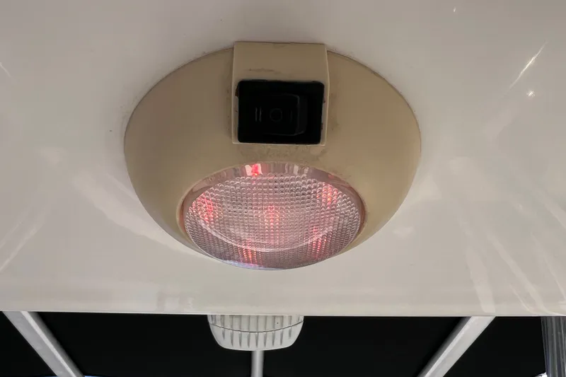 Slide: The Image of Ceiling light fixture with switch on a 2016 Key West 203 FS boat. - 37