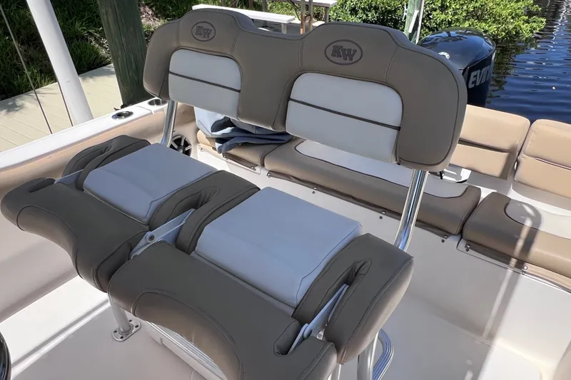 Slide: The Image of 2016 Key West 203 FS boat interior with beige and white cushioned seating. - 13