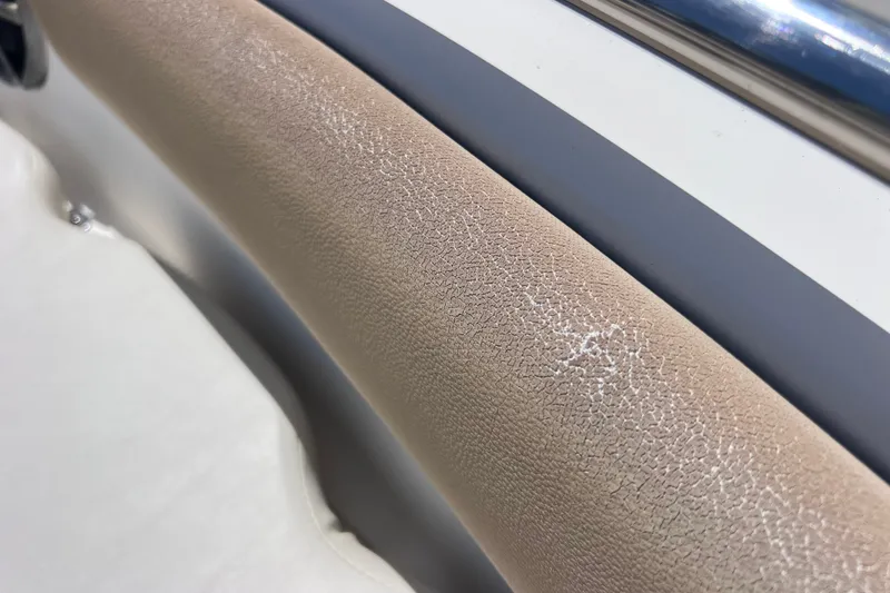 Slide: The Image of Cracked beige upholstery on 2016 Key West 203 FS boat seat. - 39