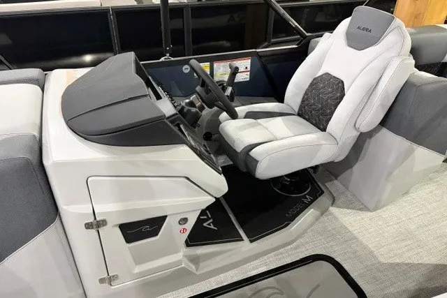 Slide: The Image of Modern Alera M21Q boat interior with sleek captain's seat and control panel, 2027 model. - 12