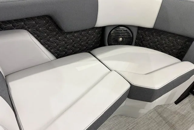 Slide: The Image of Luxurious seating in 2027 Alera M21Q boat with stylish upholstery and integrated speaker. - 19