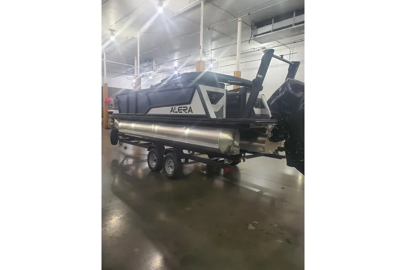 Slide: The Image of 2027 Alera M21Q pontoon boat in a warehouse setting. - 3