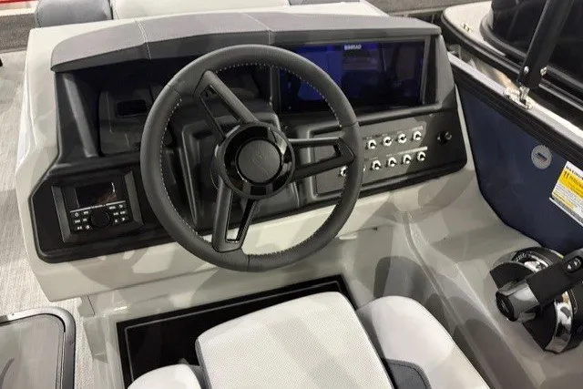 Slide: The Image of Steering console of 2027 Alera M21Q boat with modern controls and dashboard. - 16