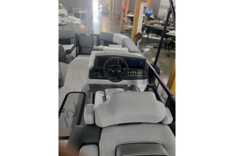 Slide: The Image of Interior view of 2027 Alera M21Q boat with modern steering and seating. - 10