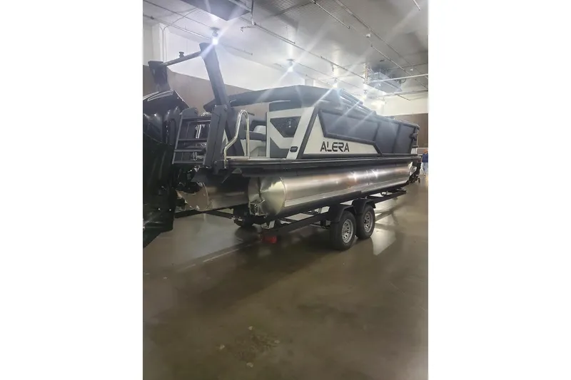 Slide: The Image of 2027 Alera M21Q pontoon boat on trailer in indoor showroom. - 4