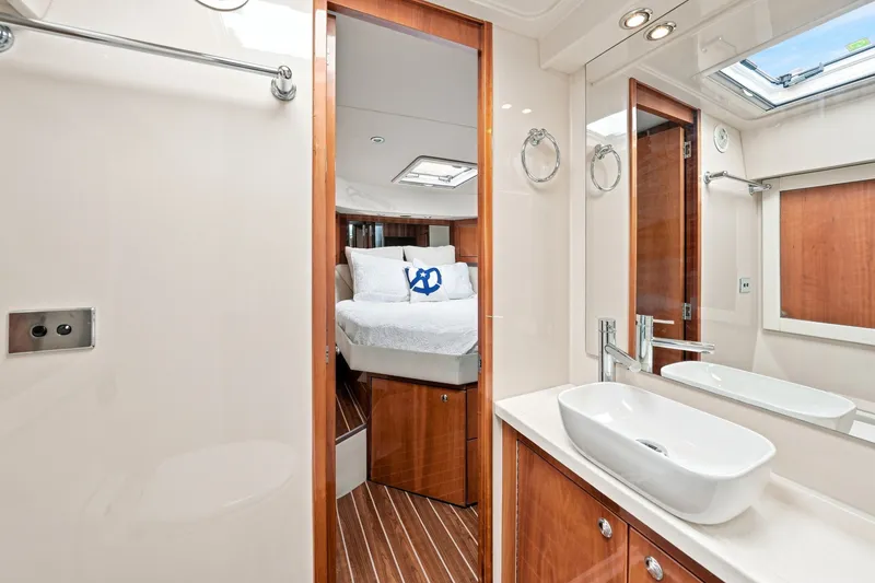 Slide: The Image of Luxurious bathroom and bedroom interior of 2009 Riviera 4700 Sport Yacht. - 25