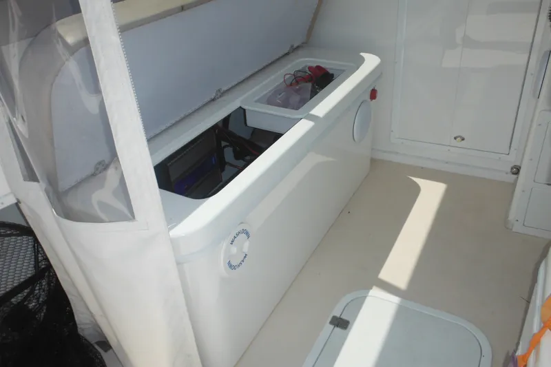 Slide: The Image of 2020 Steiger Craft 255 Miami boat interior with storage compartment open. - 37