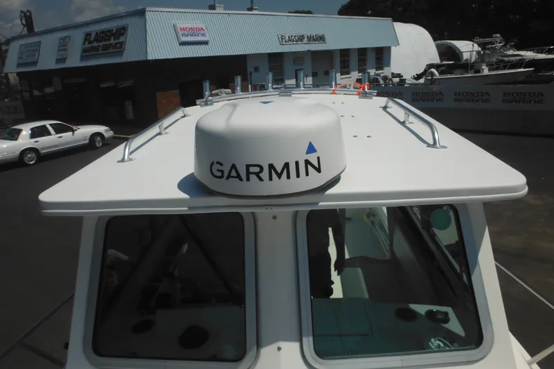 Slide: The Image of 2020 Steiger Craft 255 Miami boat with Garmin radar at marine dealership. - 21