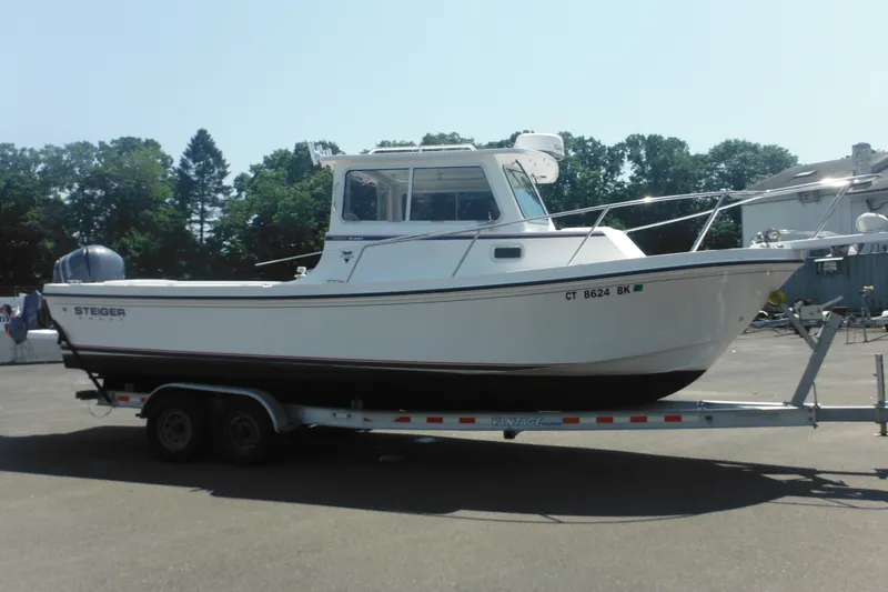 The Image of 2020 Steiger Craft 255 Miami boat on trailer, parked outdoors. - 1
