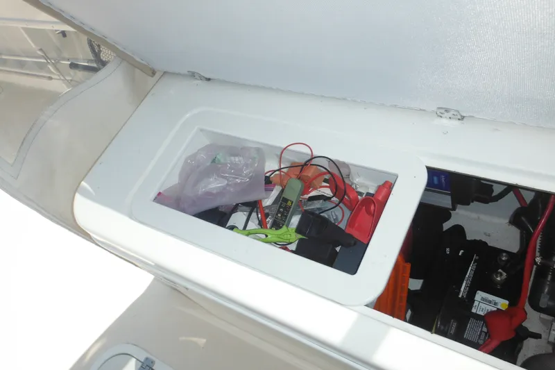 Slide: The Image of Storage compartment on a 2020 Steiger Craft 255 Miami boat with tools and equipment. - 36