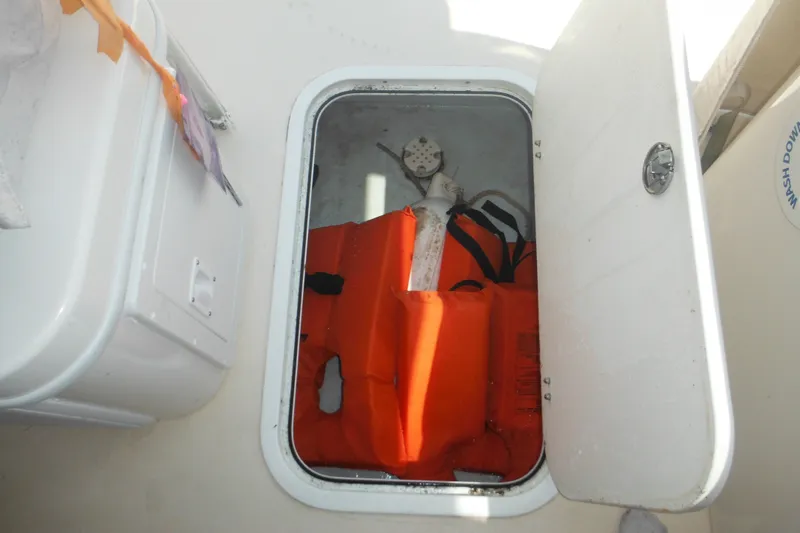 Slide: The Image of Storage compartment on a 2020 Steiger Craft 255 Miami boat with life jackets inside. - 40