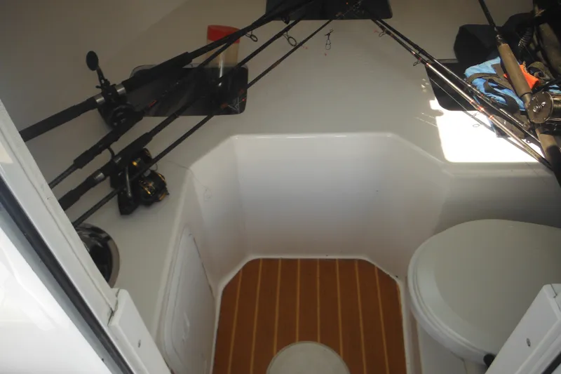 Slide: The Image of Interior of 2020 Steiger Craft 255 Miami boat with fishing rods and seating area. - 18