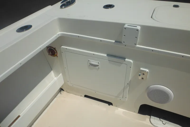 Slide: The Image of 2020 Steiger Craft 255 Miami boat interior with storage compartment and speaker. - 43