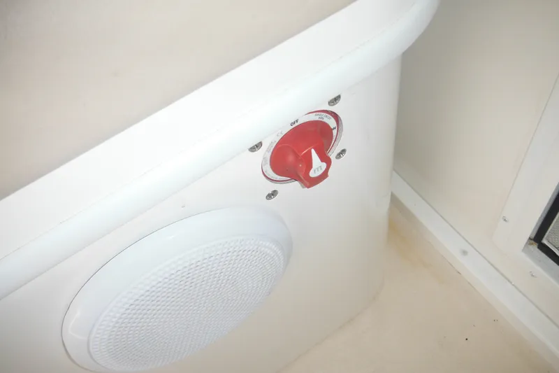 Slide: The Image of 2020 Steiger Craft 255 Miami boat interior with red battery switch and speaker. - 38