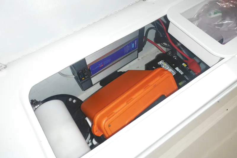Slide: The Image of Electrical compartment of 2020 Steiger Craft 255 Miami boat, featuring battery and inverter. - 33