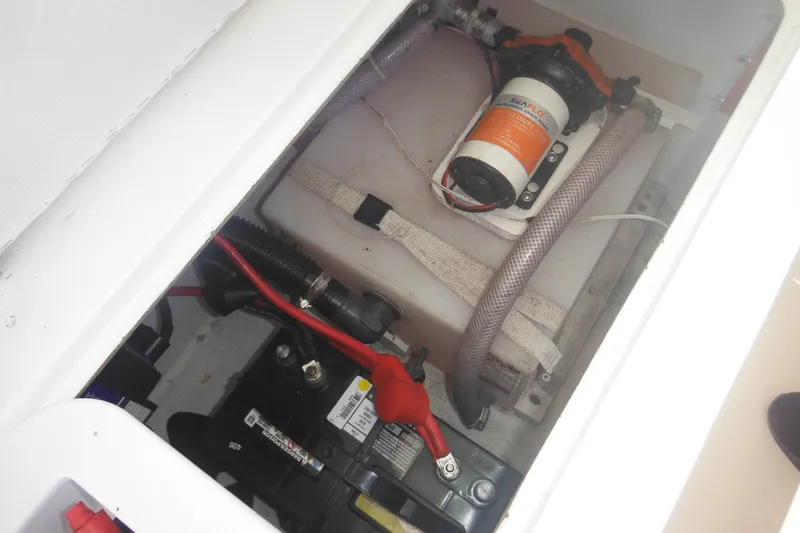 Slide: The Image of 2020 Steiger Craft 255 Miami boat battery and pump compartment. - 35