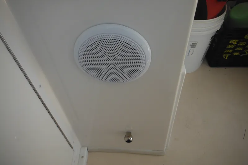 Slide: The Image of Speaker and control knob inside 2020 Steiger Craft 255 Miami boat interior. - 55