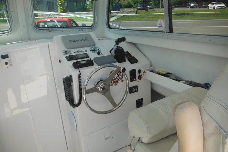 Slide: The Image of Interior helm of 2020 Steiger Craft 255 Miami boat with Garmin navigation system. - 29