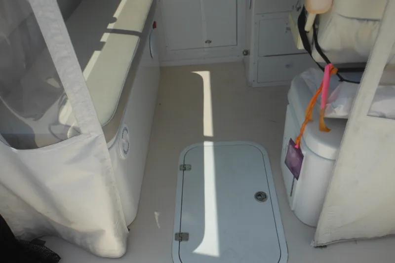 Slide: The Image of Interior view of 2020 Steiger Craft 255 Miami boat, featuring seating and storage compartments. - 30