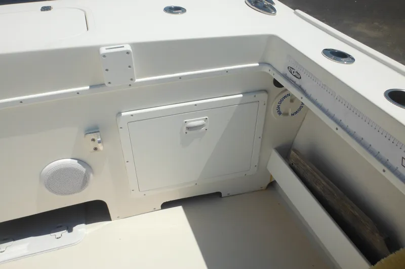 Slide: The Image of 2020 Steiger Craft 255 Miami boat interior with storage compartment and speaker. - 42