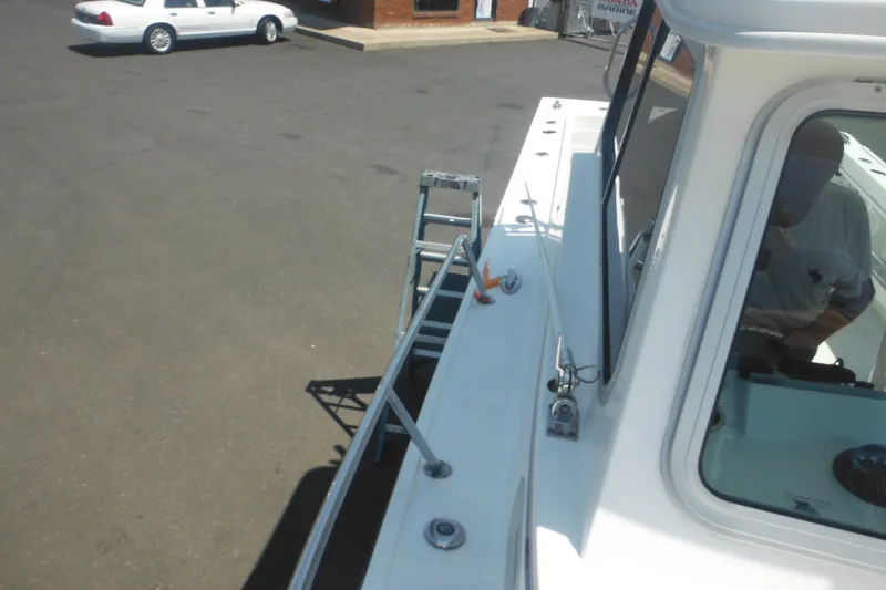 Slide: The Image of 2020 Steiger Craft 255 Miami boat docked near a parking lot. - 23