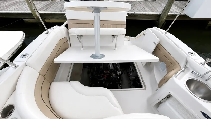 Slide: The Image of The image shows the cockpit of a 2006 Four Winns 278 Vista with a table and seating. - 4