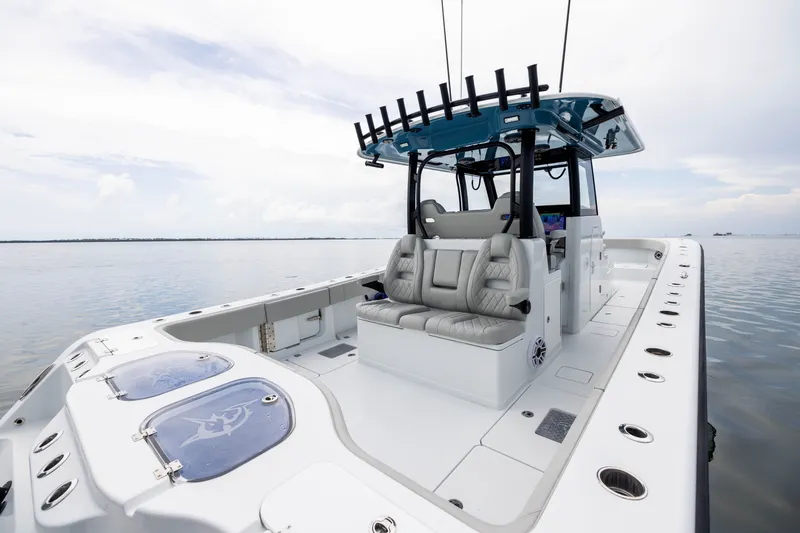 Slide: The Image of 2025 Freeman 35 boat with sleek design, spacious seating, and modern amenities on calm waters. - 40