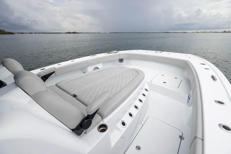 Slide: The Image of Luxurious 2025 Freeman 35 boat interior with cushioned seating on calm waters. - 14
