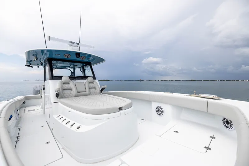 Slide: The Image of 2025 Freeman 35 boat with spacious deck and luxurious seating on calm waters. - 19