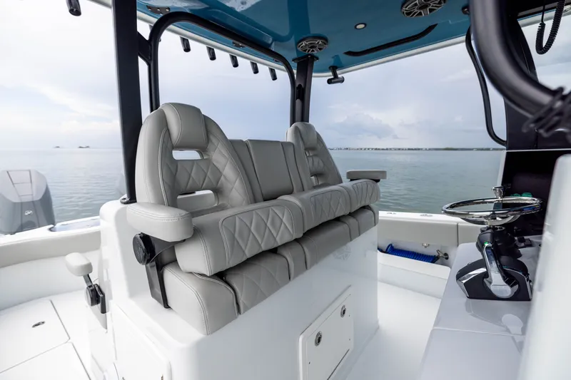 Slide: The Image of Luxurious seating on a 2025 Freeman 35 boat, featuring modern design and ocean backdrop. - 27