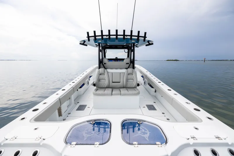 Slide: The Image of 2025 Freeman 35 boat with spacious deck and seating on calm waters. - 39